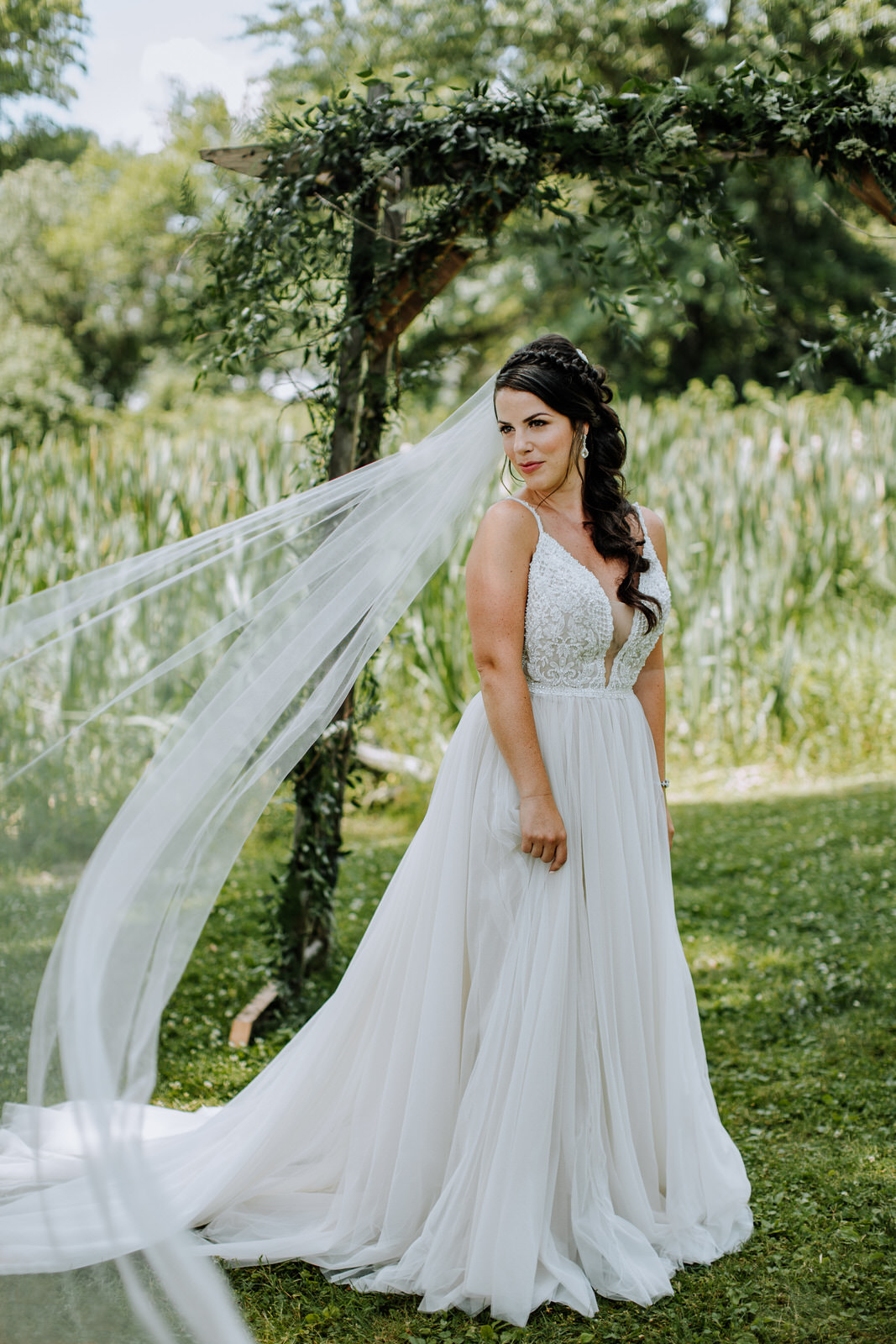 Bridal portrait with veil sweeping in the wind