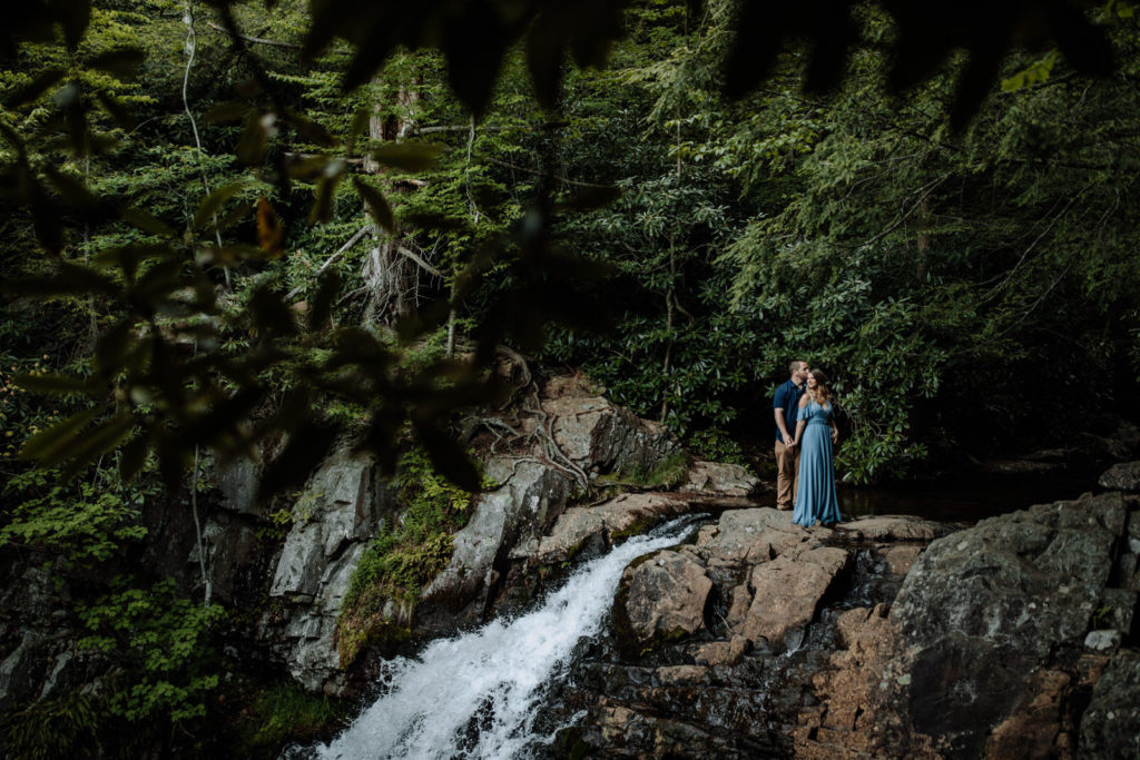Fine art couples photography at Hickory Run State Park. Couple standing at top of waterfall. 