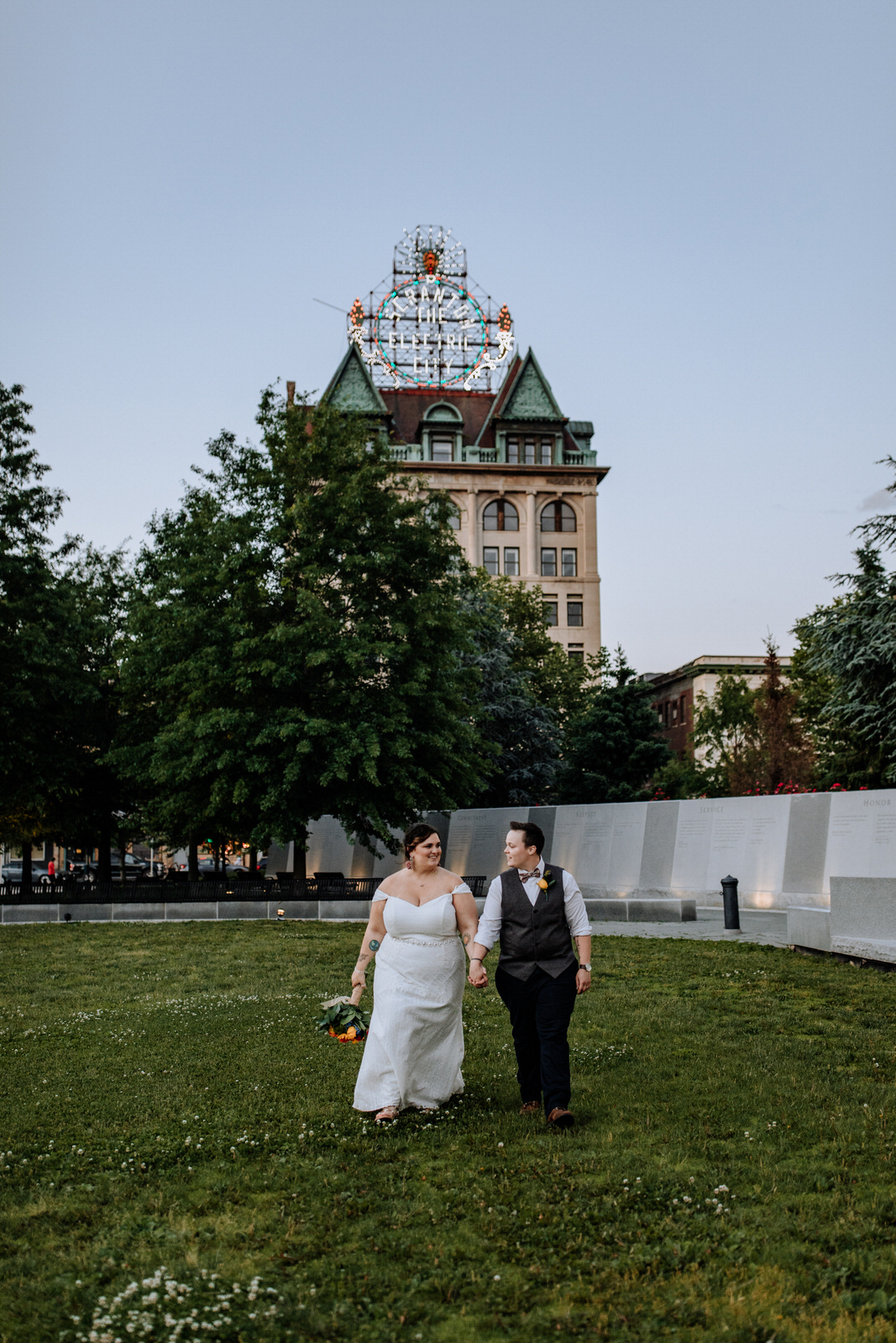 Two married women walking in front of Scranton Electric City building