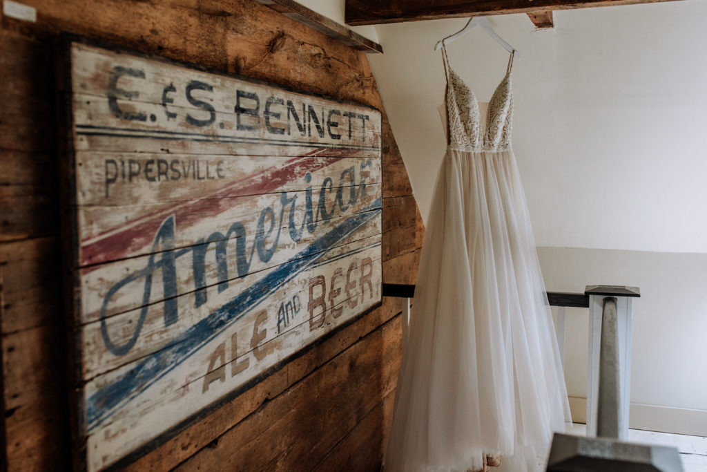 Wedding dress shot featuring Americana art at Galvanized America Inn