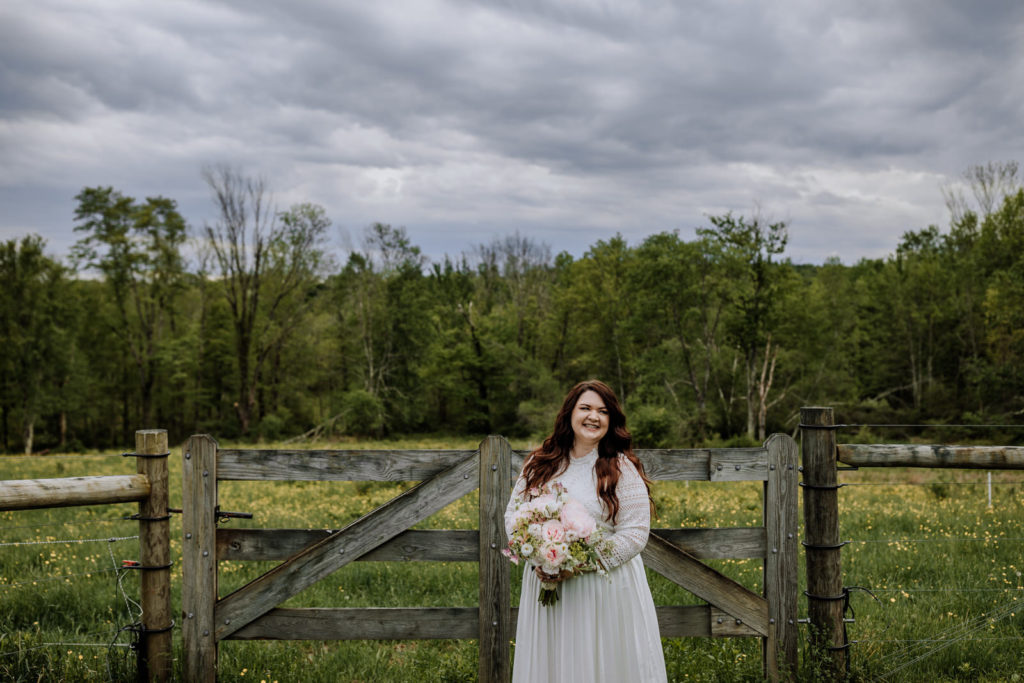 Portrait of a bride with moody skies in the background