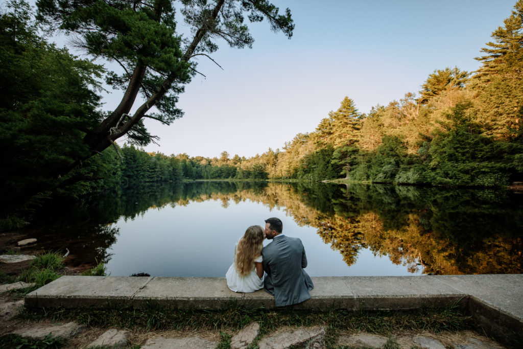 Man and woman kissing at Hickory Run State Park lake