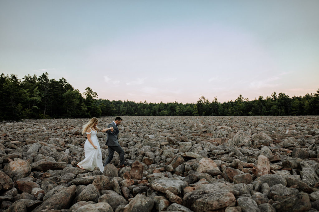 Man and woman walking at Hickory Run State Park boulder field