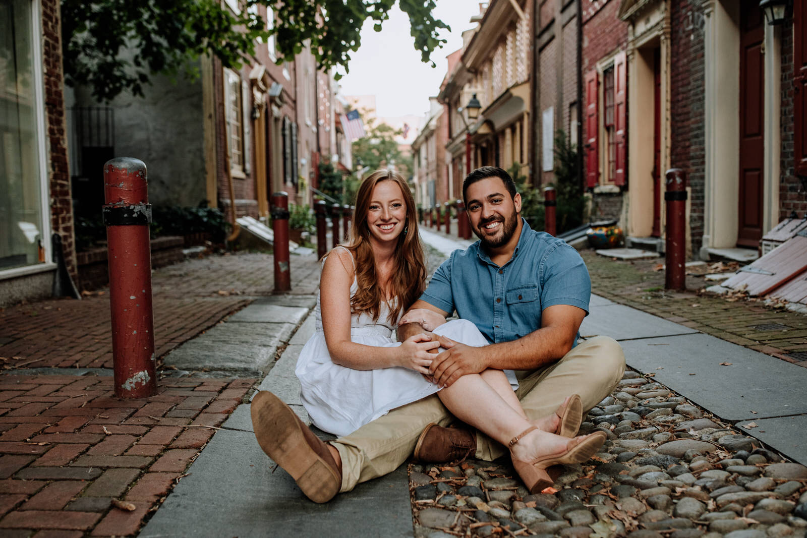 Portrait of a couple sitting at Elfreth's Alley in Philadelphia, PA