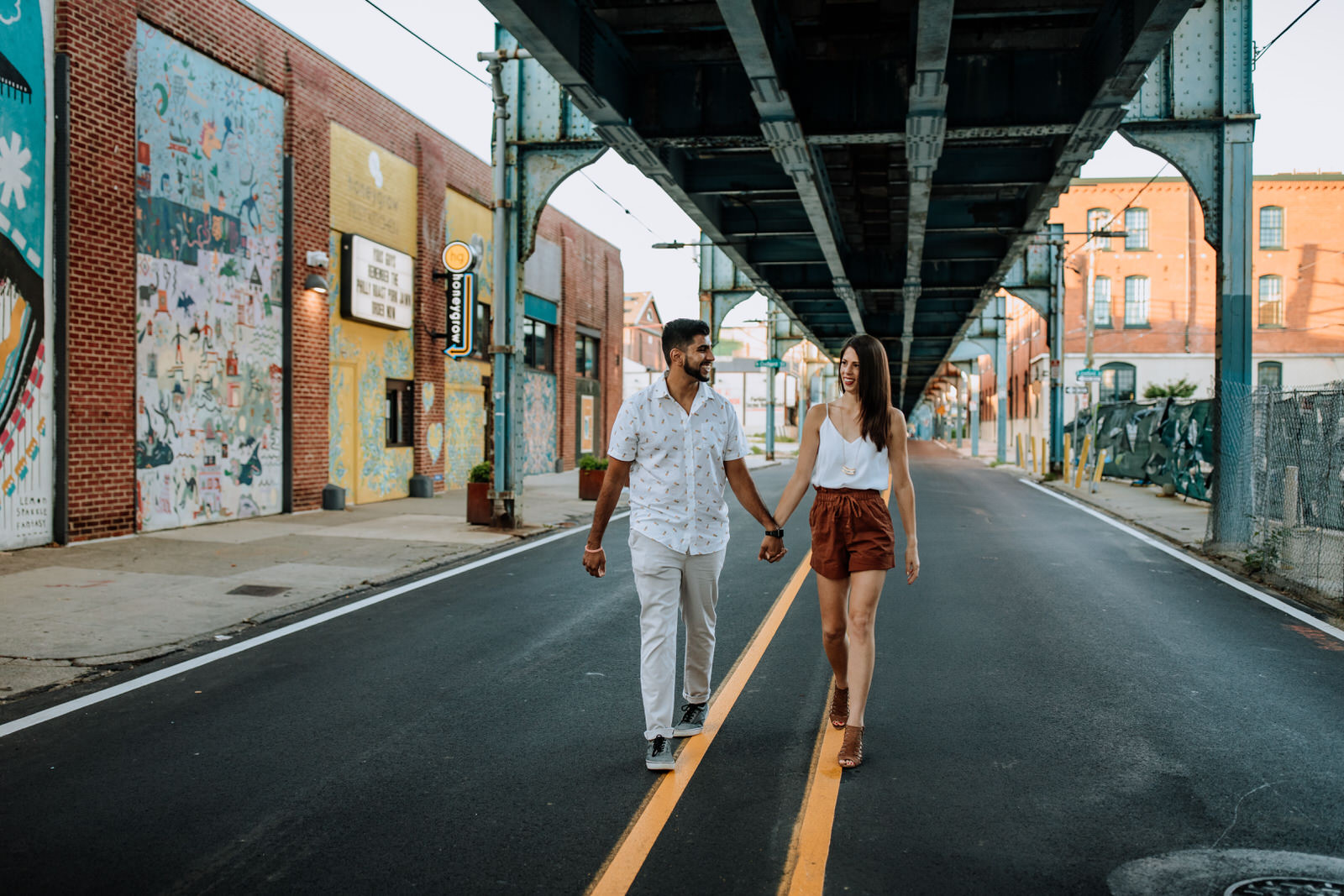 Couple walking on Front Street in Philly, PA