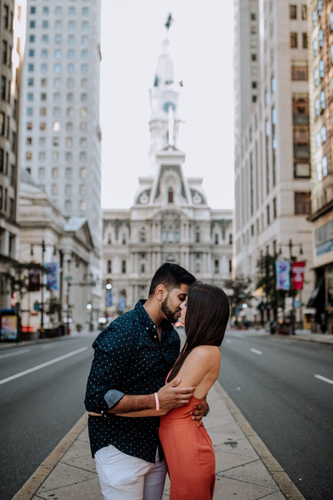 Couple kissing in front of City Hall in Philadelphia, PA