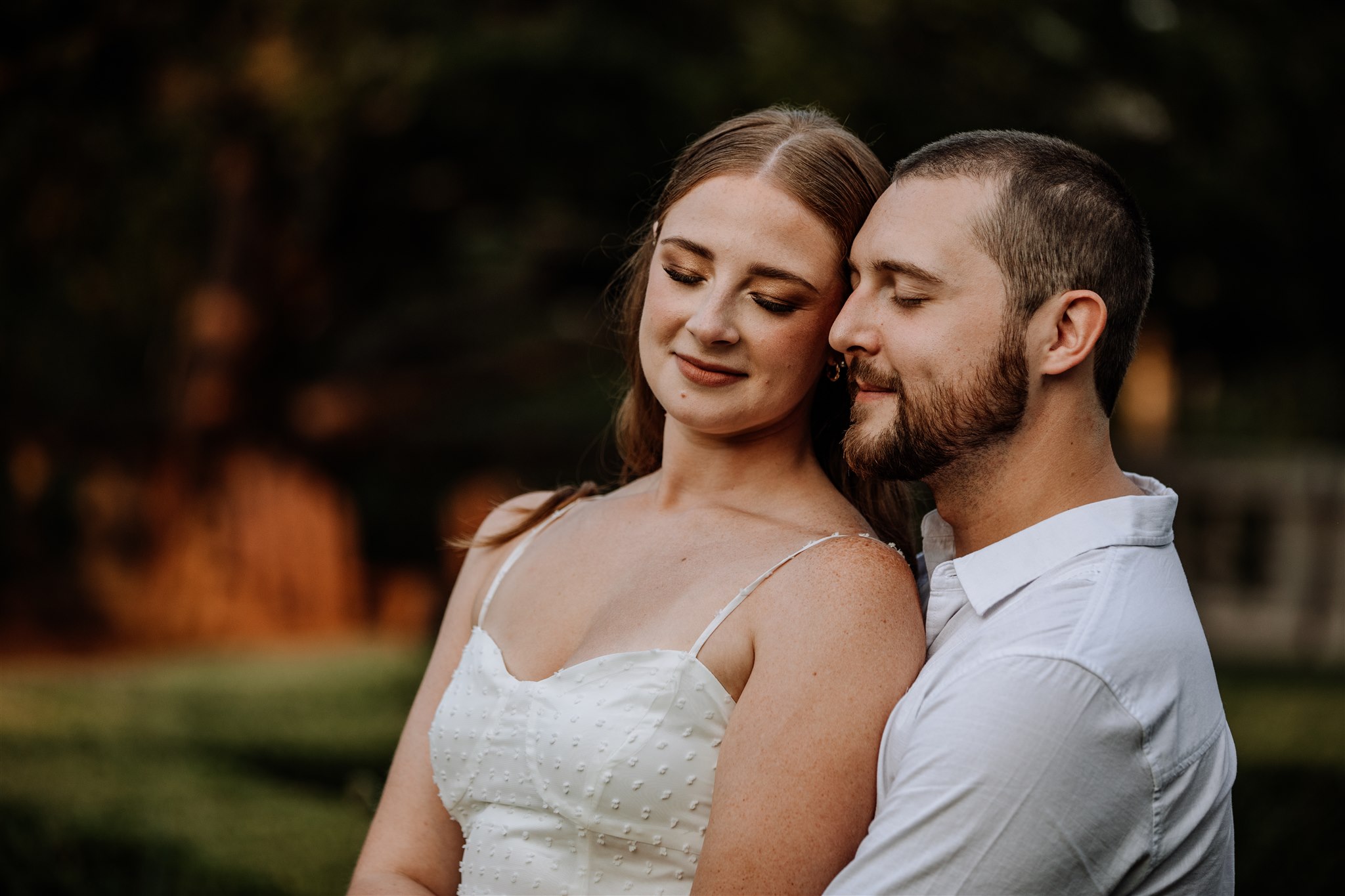 Couple holding each other with eyes closed