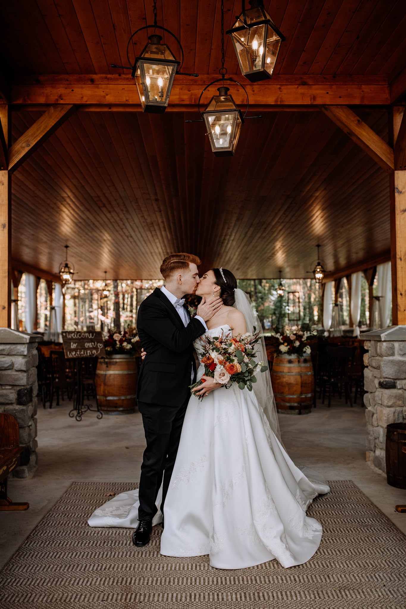 Couple kissing under pavilion at Trout Lake Retreats